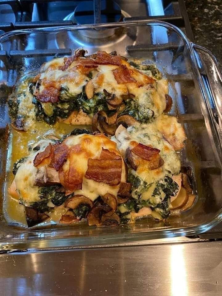 Smothered chicken with creamed spinach, bacon, mushrooms