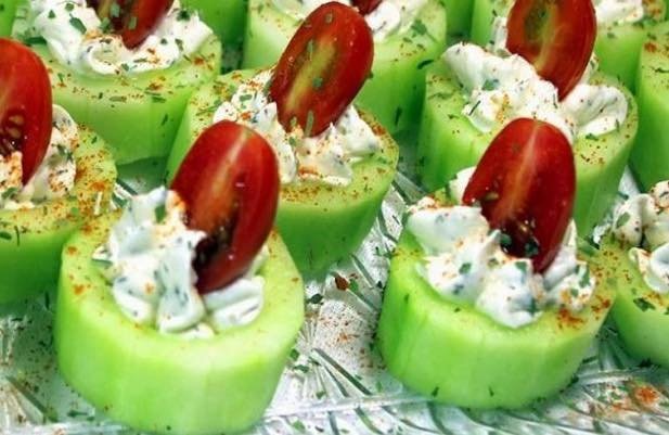 Cucumber bites with herb cream cheese and cherry tomatoes