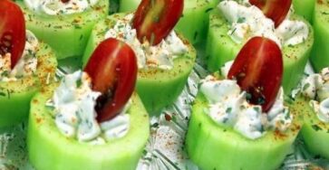 Cucumber bites with herb cream cheese and cherry tomatoes