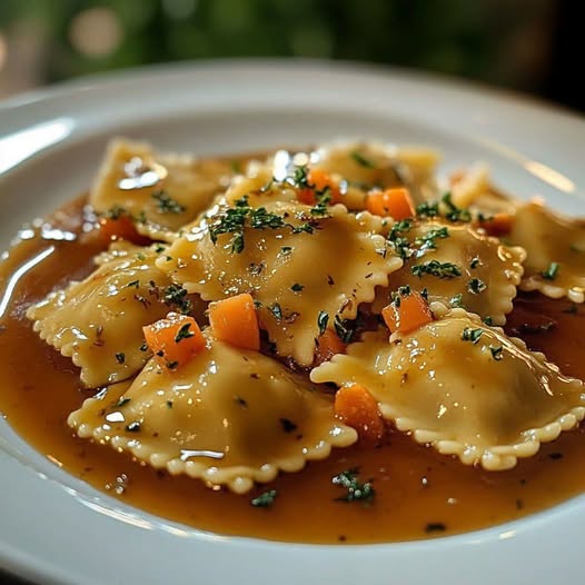 Brown butter herb ravioli with diced carrots