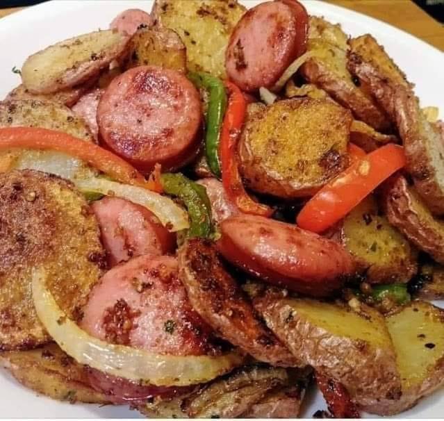 Fried potatoes onions and smoked polish sausage