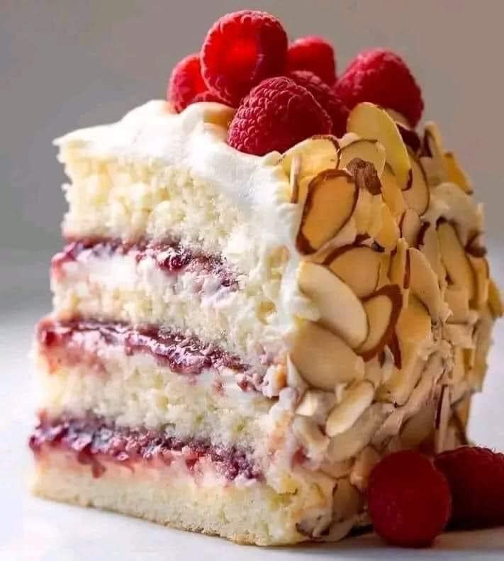 This Almond Raspberry Cake With White Chocolate Amaretto Buttercream Frosting